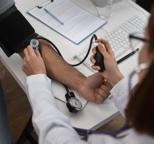 high-angle-doctor-checking-patient
